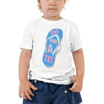 little girl prepárate on a chancleta on a white toddler t-shirt